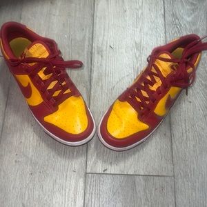 Yellow and red low top nike shoes